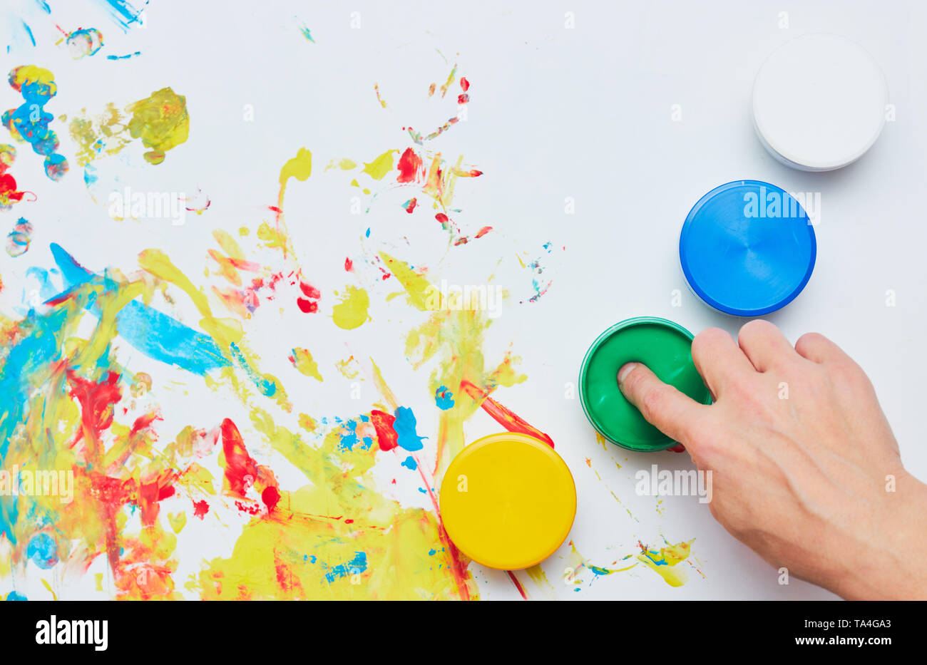 Kid Using Ink a child draws. a child's drawing inks, finger paints, hand prints Stock ...