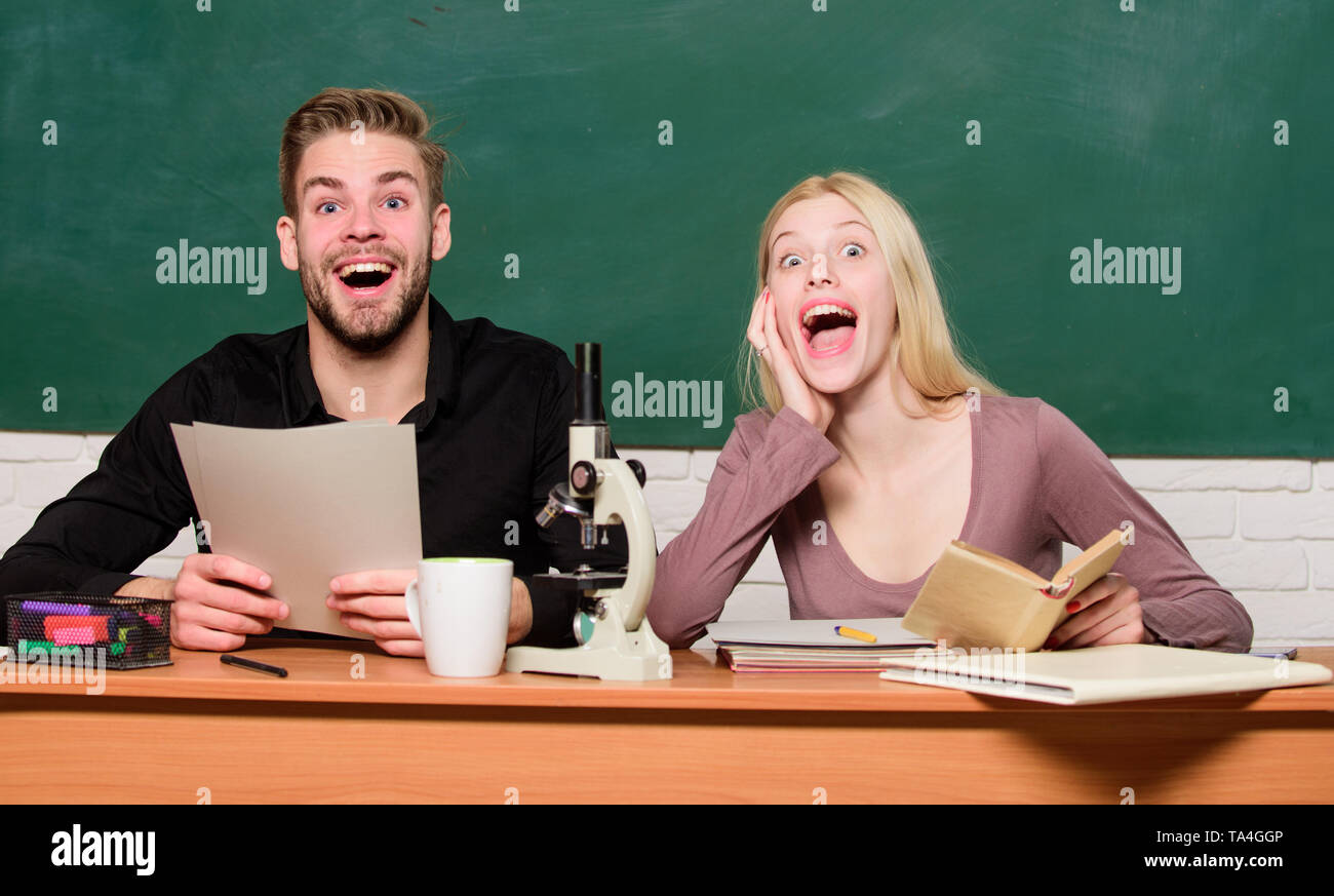 Back to school. Couple of man and woman in classroom. Home schooling ...