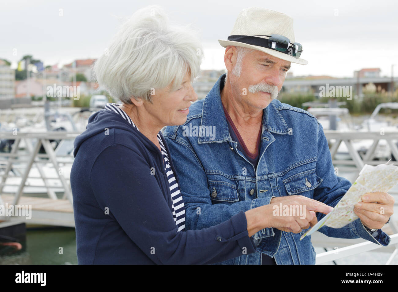 senior couple with map outside Stock Photo