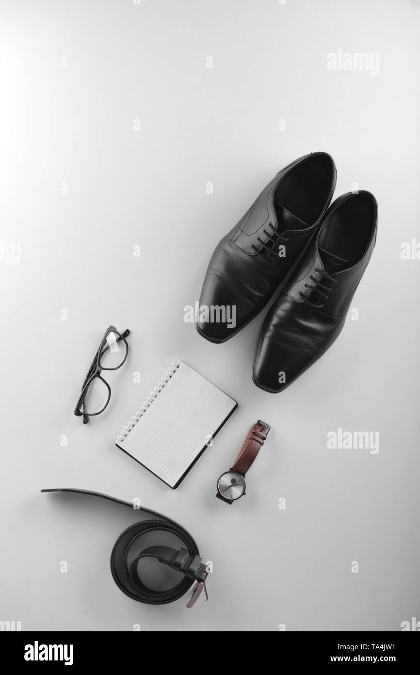 Stylish men's accessories with notebook on white background Stock Photo