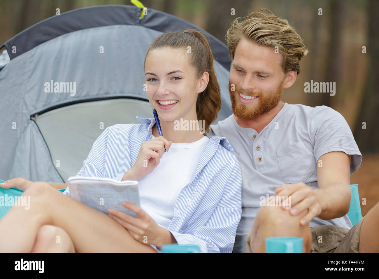 couple relaxing in tent Stock Photo