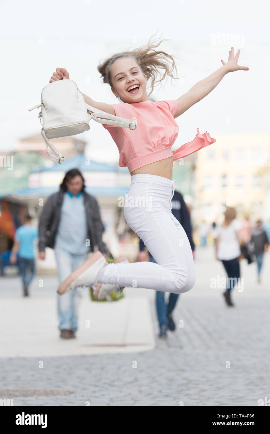 Her style is a lot more casual. Happy small girl jumping in casual and  comfy outfit. Little cute child smiling in casual style. Casual and  comfortable Stock Photo - Alamy