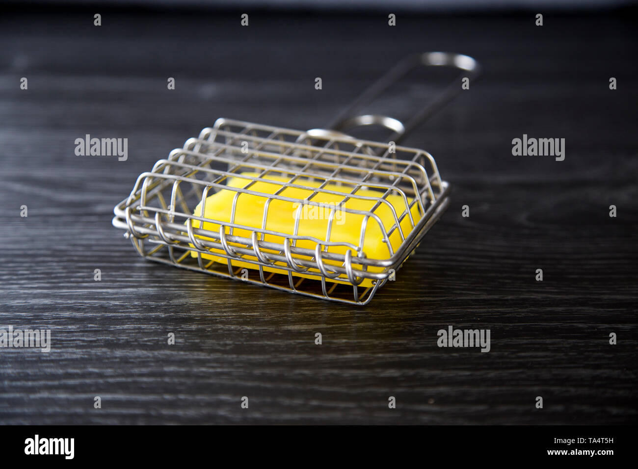 Stainless steel soap shaker with bar inside. Used to create soapy water