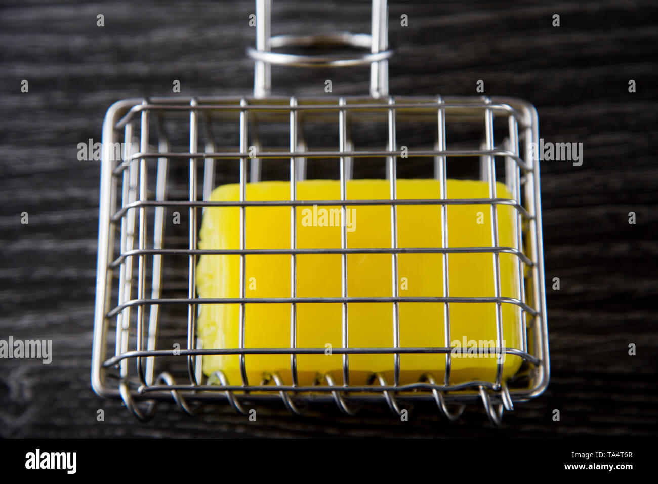 Stainless steel soap shaker with bar inside. Used to create soapy water