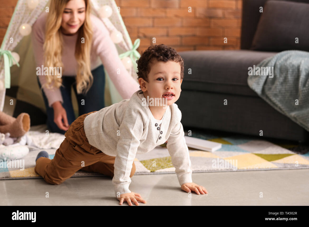 Cute little boy with mother playing at home Stock Photo - Alamy