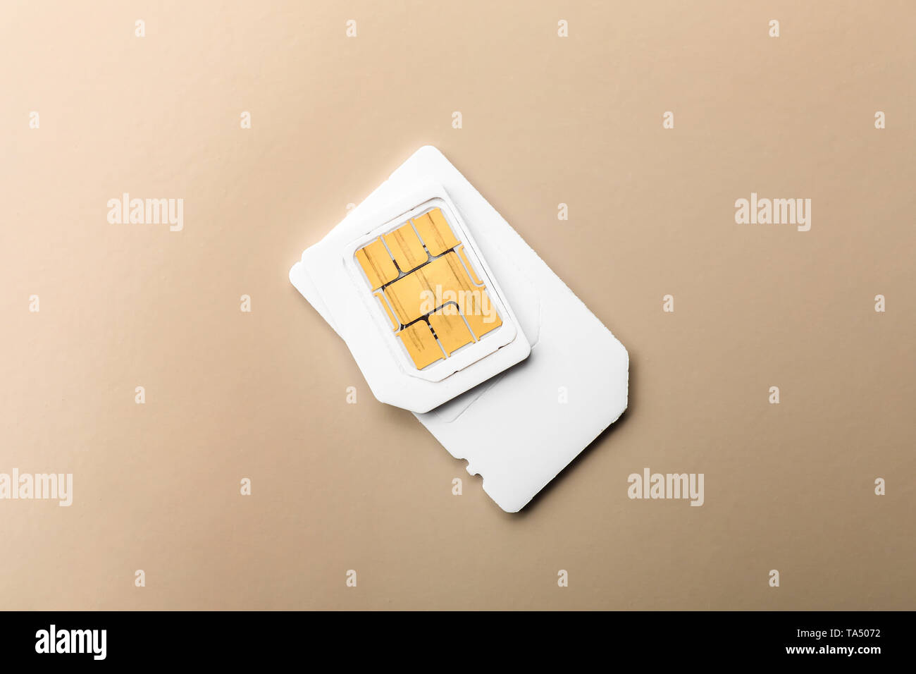 Sim card on color background Stock Photo