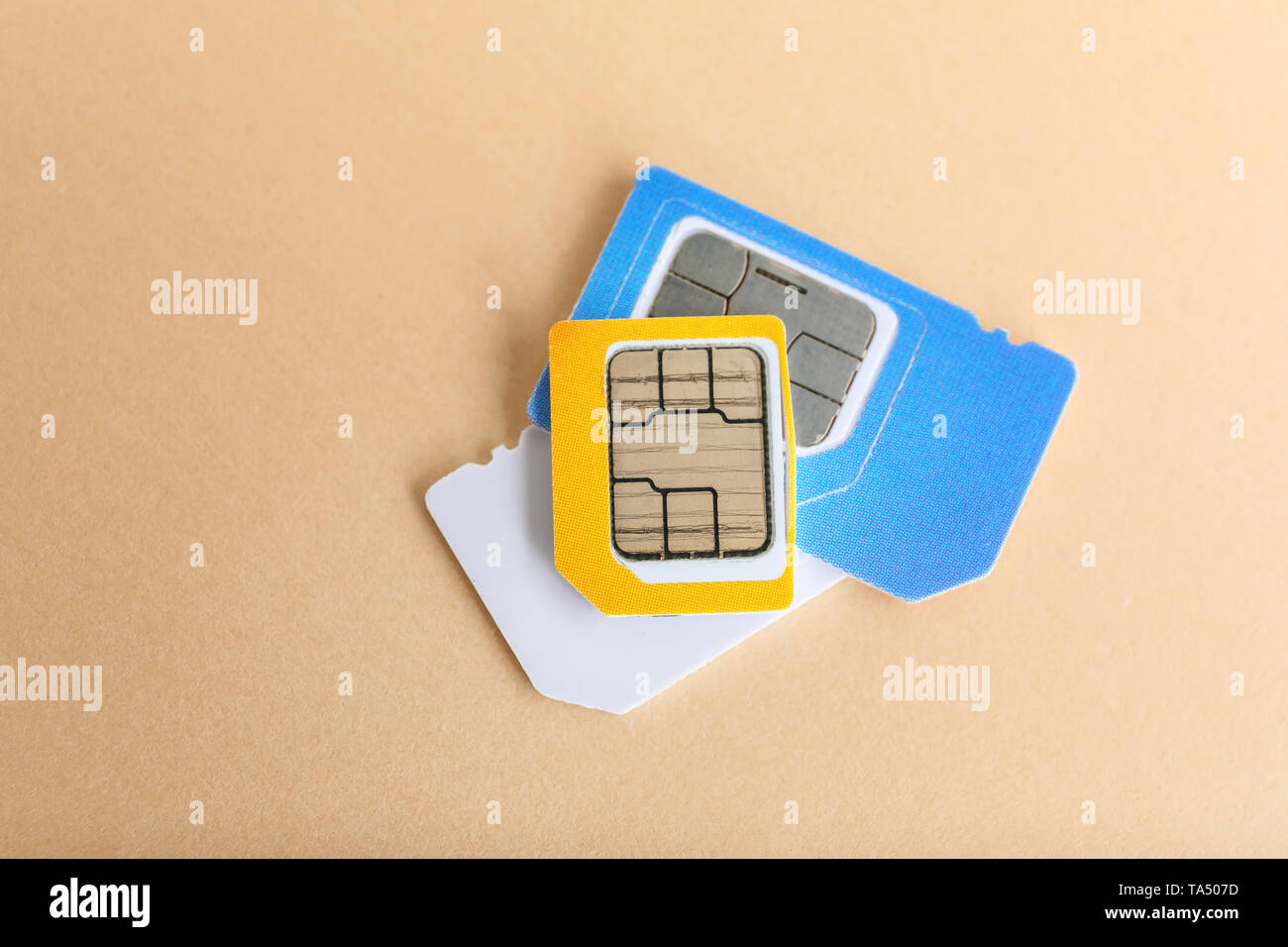 Sim cards on color background Stock Photo