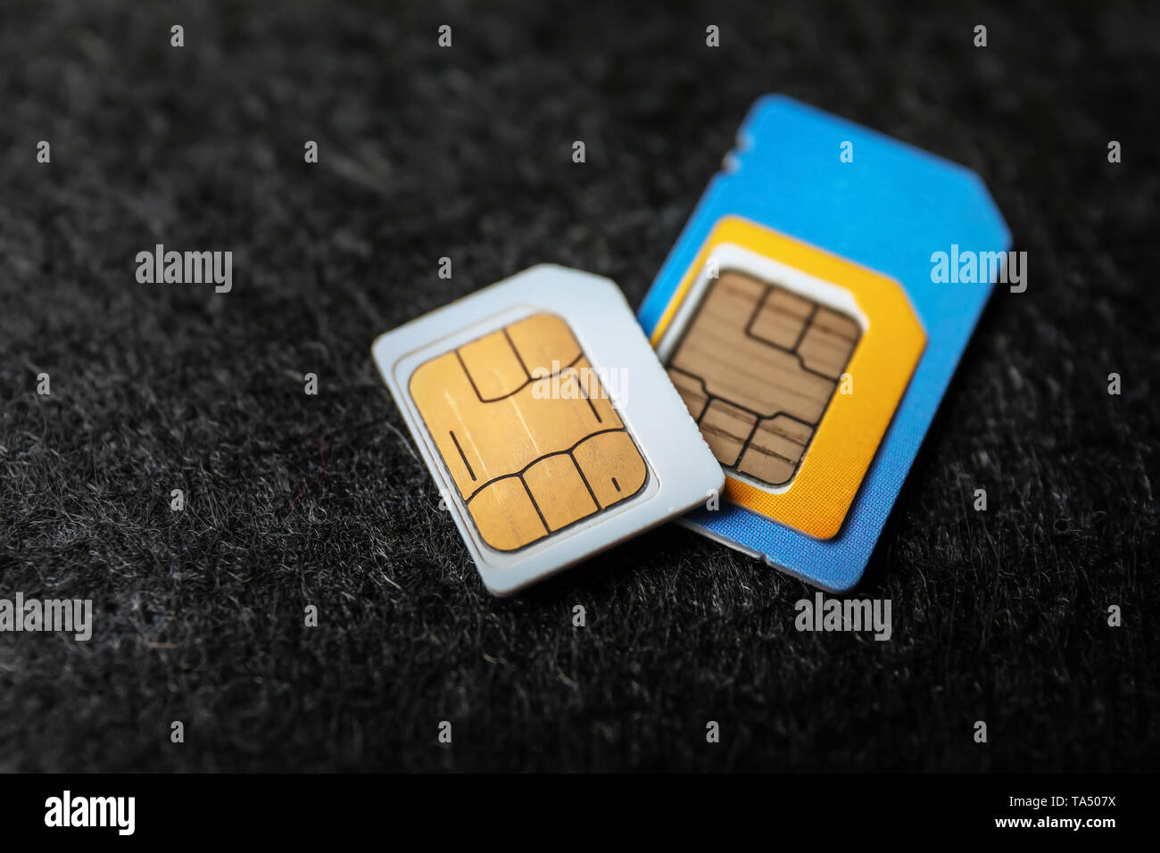 Sim cards on dark background Stock Photo