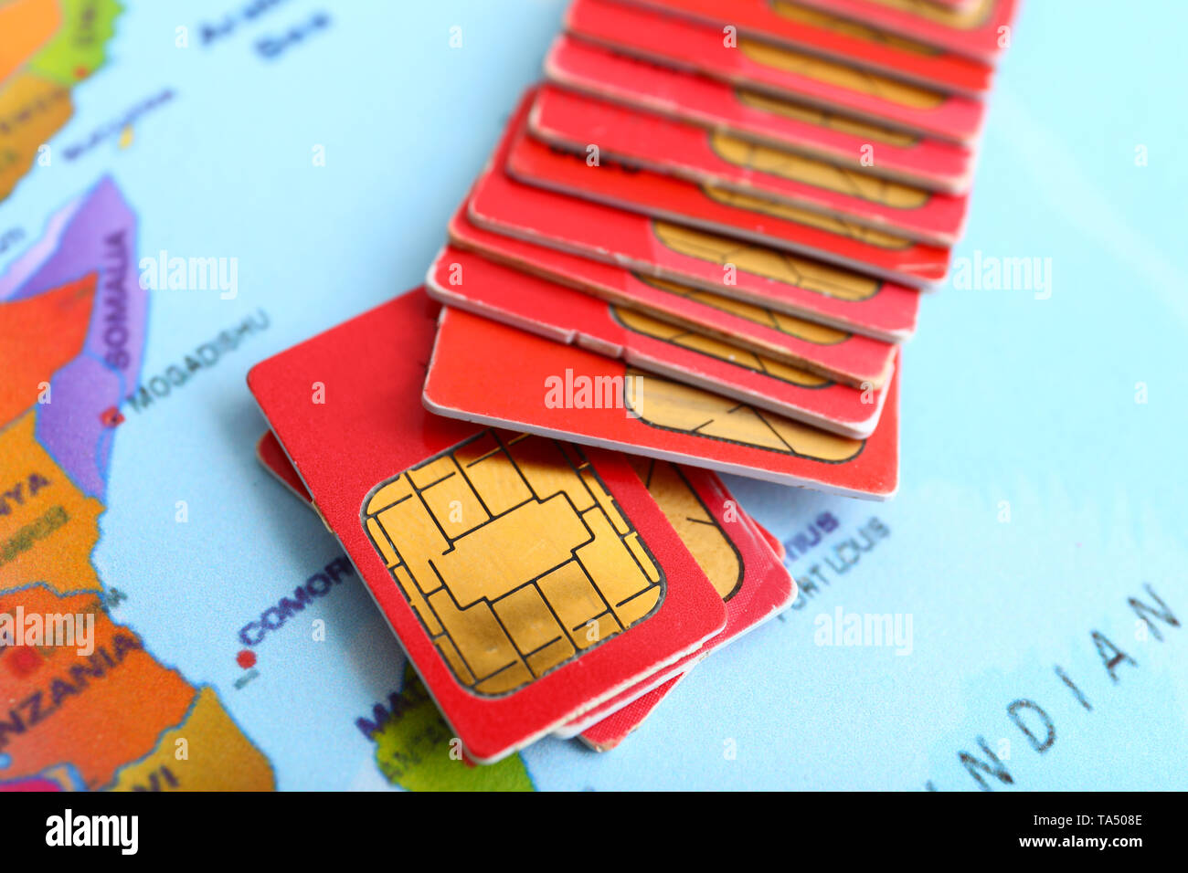 Many sim cards on world map Stock Photo Alamy