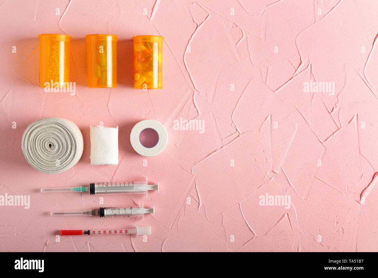 First aid kit on color background Stock Photo - Alamy