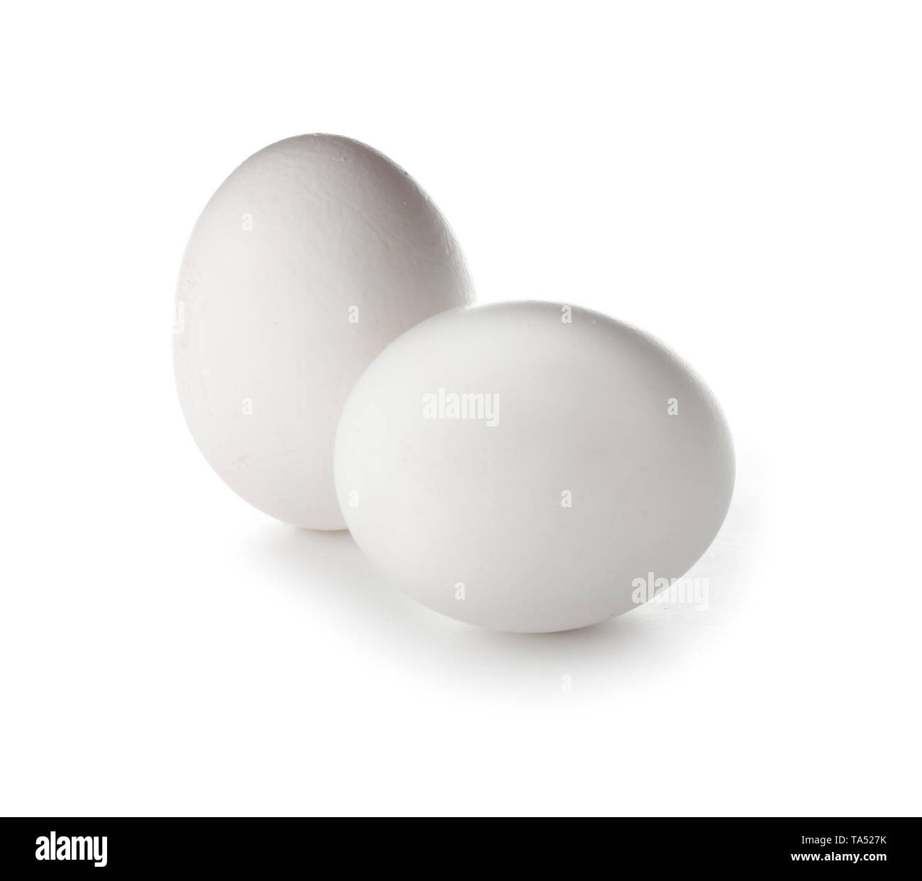 Raw chicken eggs on white background Stock Photo - Alamy