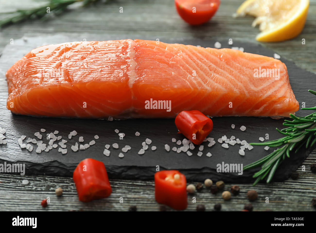 Raw salmon fillet on slate board Stock Photo - Alamy