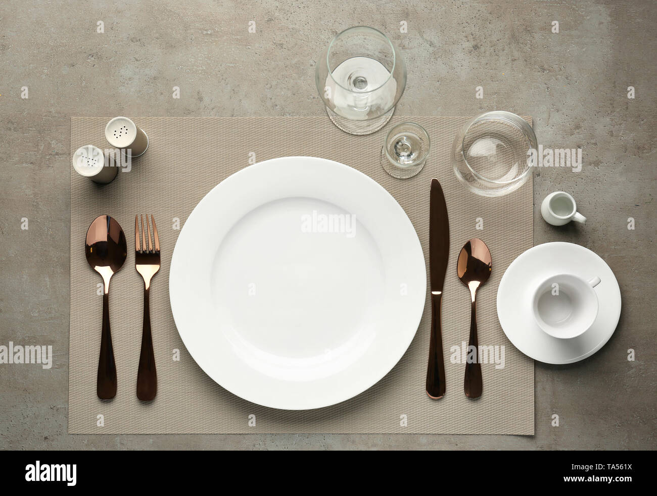 Simple table setting on grey background Stock Photo