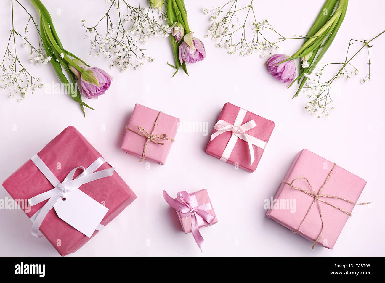 Handmade gift boxes and flowers on white background Stock Photo Alamy