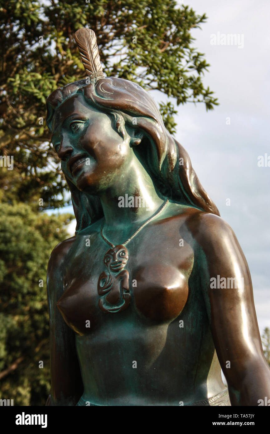 Portrait of the iconic bronze Statue of the Maori Girl, Pania of the Reef in Napier, New Zealand Stock Photo