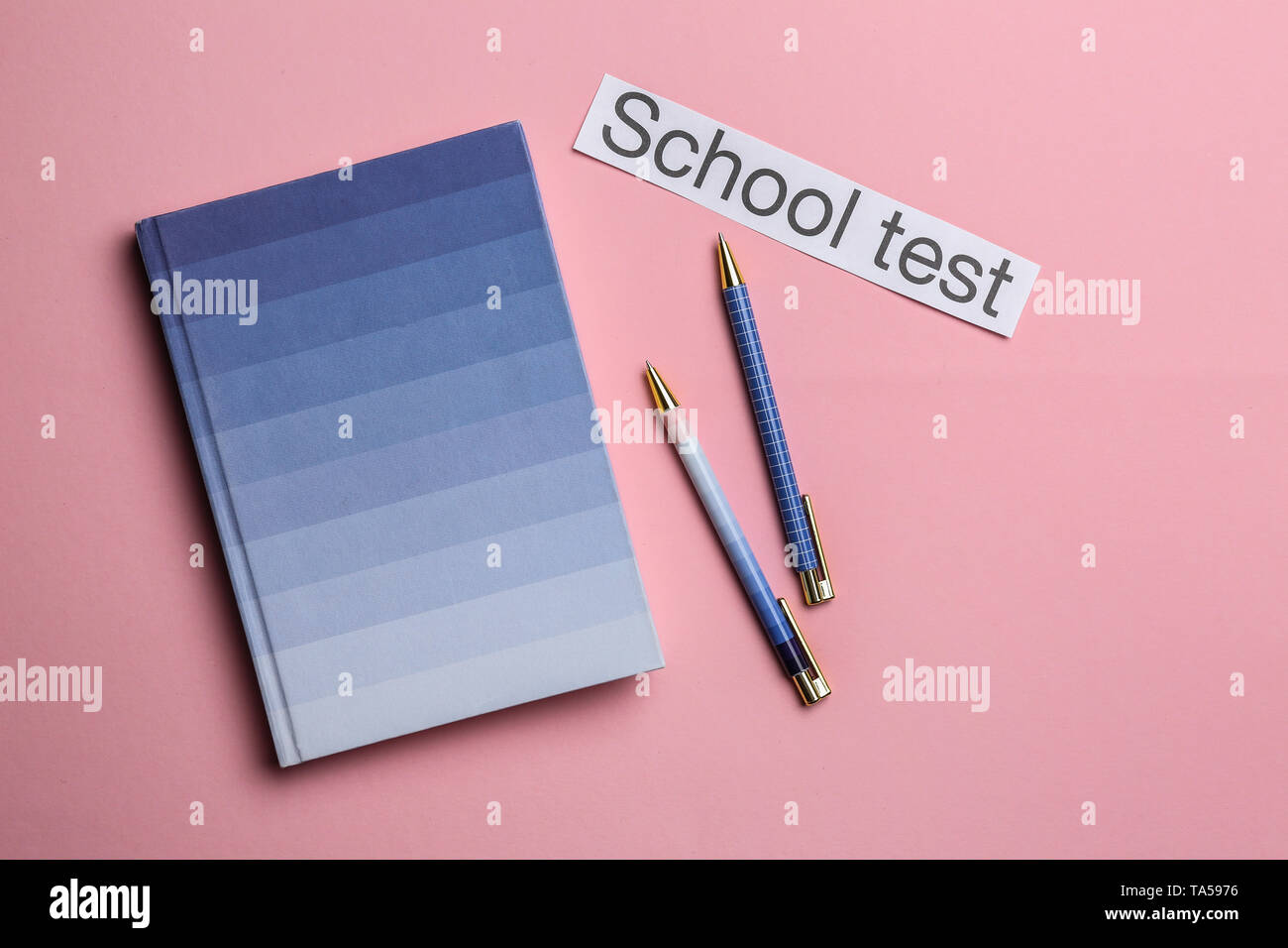 Notebook Pens And Paper With Text School Test On Color Background