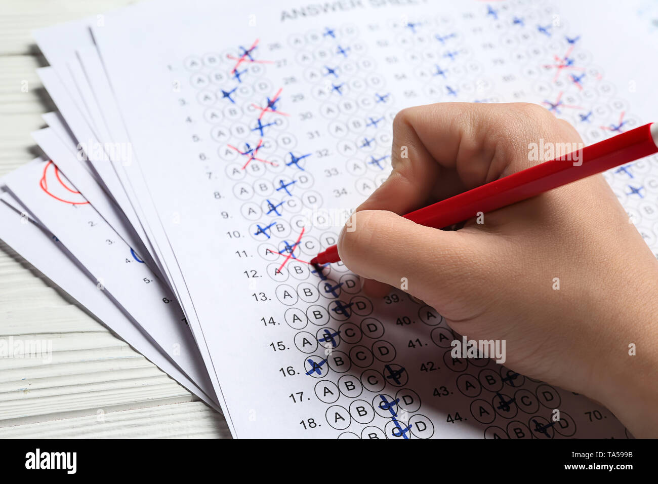 Teacher checking answer sheet after exam, closeup Stock Photo Alamy
