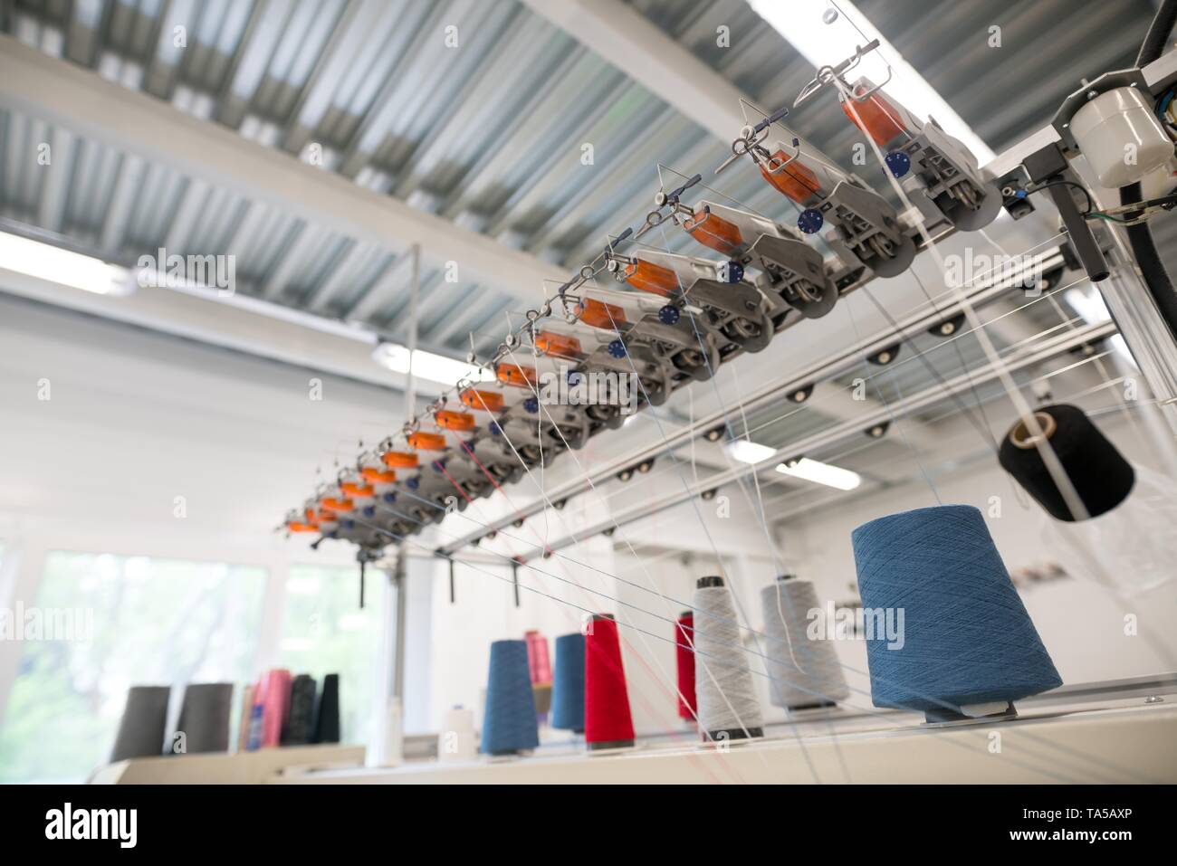 Sewing thread bobbin on machine Stock Photo Alamy