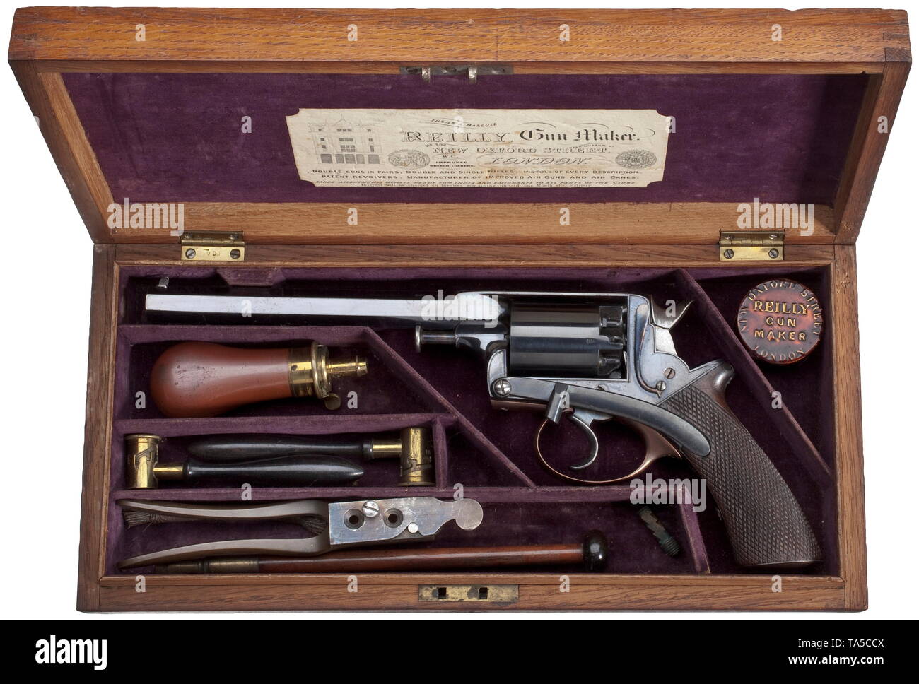 A Reilly percussion revolver, Beaumont Adams system, circa 1860 12.2 mm calibre, no. 16.349.R. Octagonal 7 1/4' barrel, bright bore, acceptance marks on top left. On topstrap marked 'Reilly, 315 & 502 Oxford Stt. London.' Five-shot cylinder, also with acceptance marks. On right side of topstrap number and patent data as well as colour case hardened sliding safety, press on the left. Barrel and frame with deep black, original finish. Hammer lightly damaged on the right. Cylinder re-blued. Trigger frame and grip cap with modern, reddish finish. One, Additional-Rights-Clearance-Info-Not-Available Stock Photo