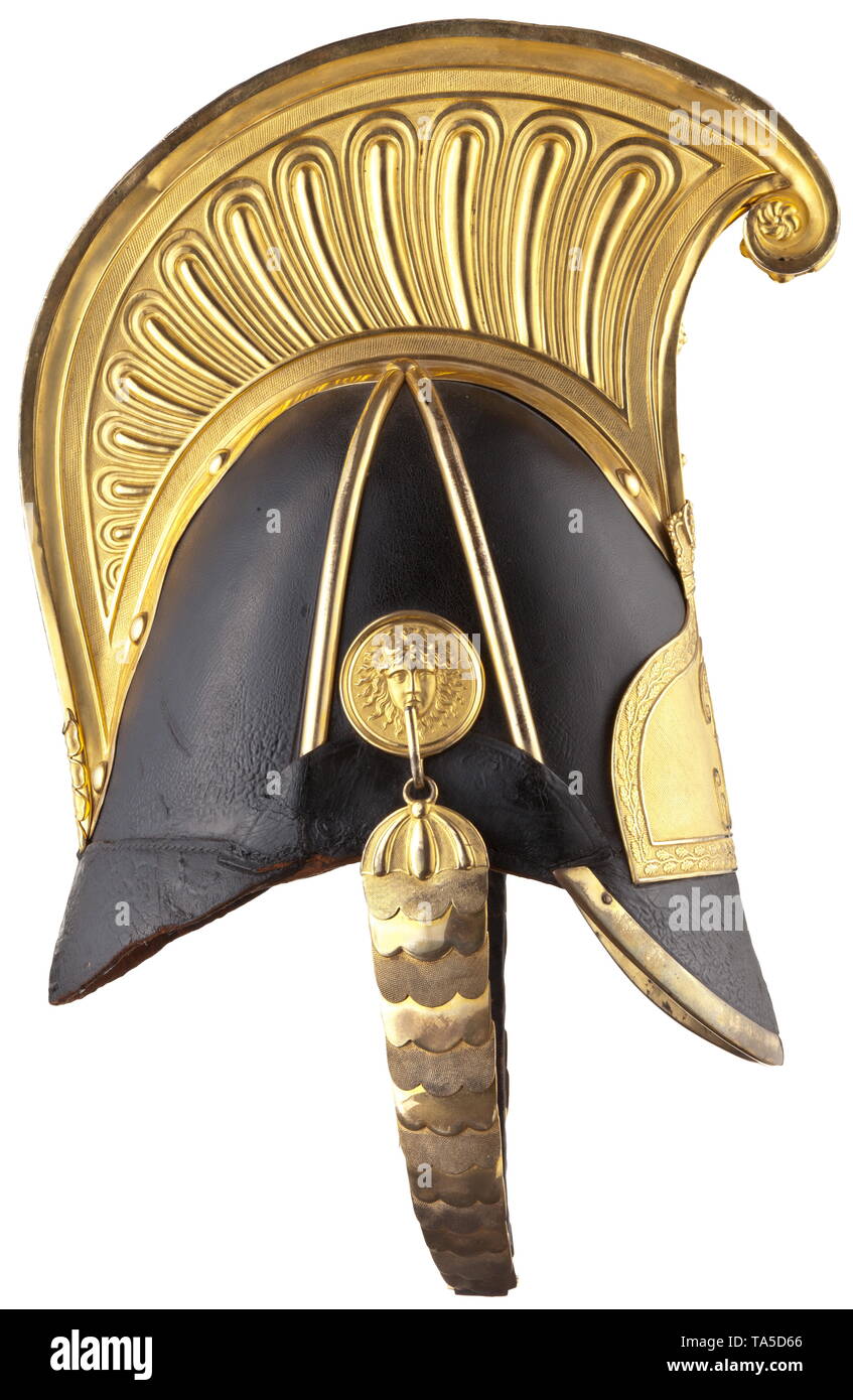 A helmet for officers of the Horse Guard Regiment M 1854 until 1867, circa 1855 High, elegant leather skull, complete with all fittings in fire-gilt version. High, embossed comb, lateral protective bars. A large plaque with crowned monogram 'JR' for King John (reigned 1854 - 1873) on the front. Special version of flat, gilt chinscales, mounting with Medusa's head with Saxon cockade above it on the left side. Black leather liner with loops and golden border. Signs of age and usage. Only slightly worn in beautiful original condition with the old or, Additional-Rights-Clearance-Info-Not-Available Stock Photo