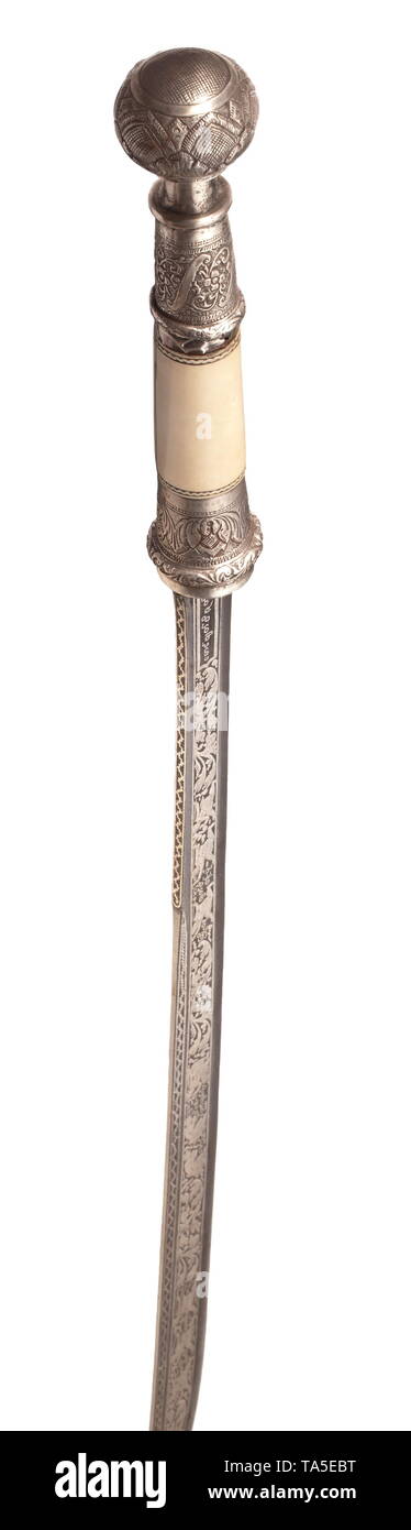 A Burmese presentation dha, dated 1931 Slightly curved, single-edged blade with a double-edged point and shallow fullers on both sides. Rich silver inlays with inscriptions and figures amid leafy vines. The ivory grip with hammered and chased silver mountings. The scabbard of sheet silver with elaborately hammered, partially sculptured figures. At the base, a cartouche bearing the dedication 'Presented to Capt. F.O. Hodkinson by his Excellency Sir Joseph Maung Gyi Kt, January 1931'. Two suspension rings with silk cord attached. Length 95 cm. hist, Additional-Rights-Clearance-Info-Not-Available Stock Photo