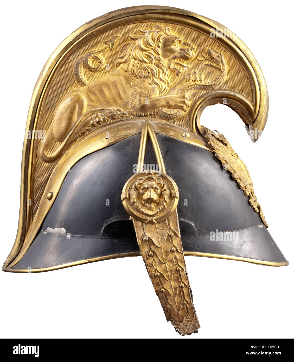 A helmet for officers of the imperial-royal dragoons, circa 1900 Elegant sheet steel body (bumped), black lacquered, complete with all mounts in fire-gilt version. Emblem with large crowned eagle and ruler's cypher 'FJI'. The chinscales on large lion head rosettes. Tall comb, on both sides embossed lion with snake. Damaged lining and sweatband. Signs of age. Worn helmet in uncleaned as found condition. historic, historical, Imperial, Austria, Austrian, Danube Monarchy, Empire, 20th century, Additional-Rights-Clearance-Info-Not-Available Stock Photo