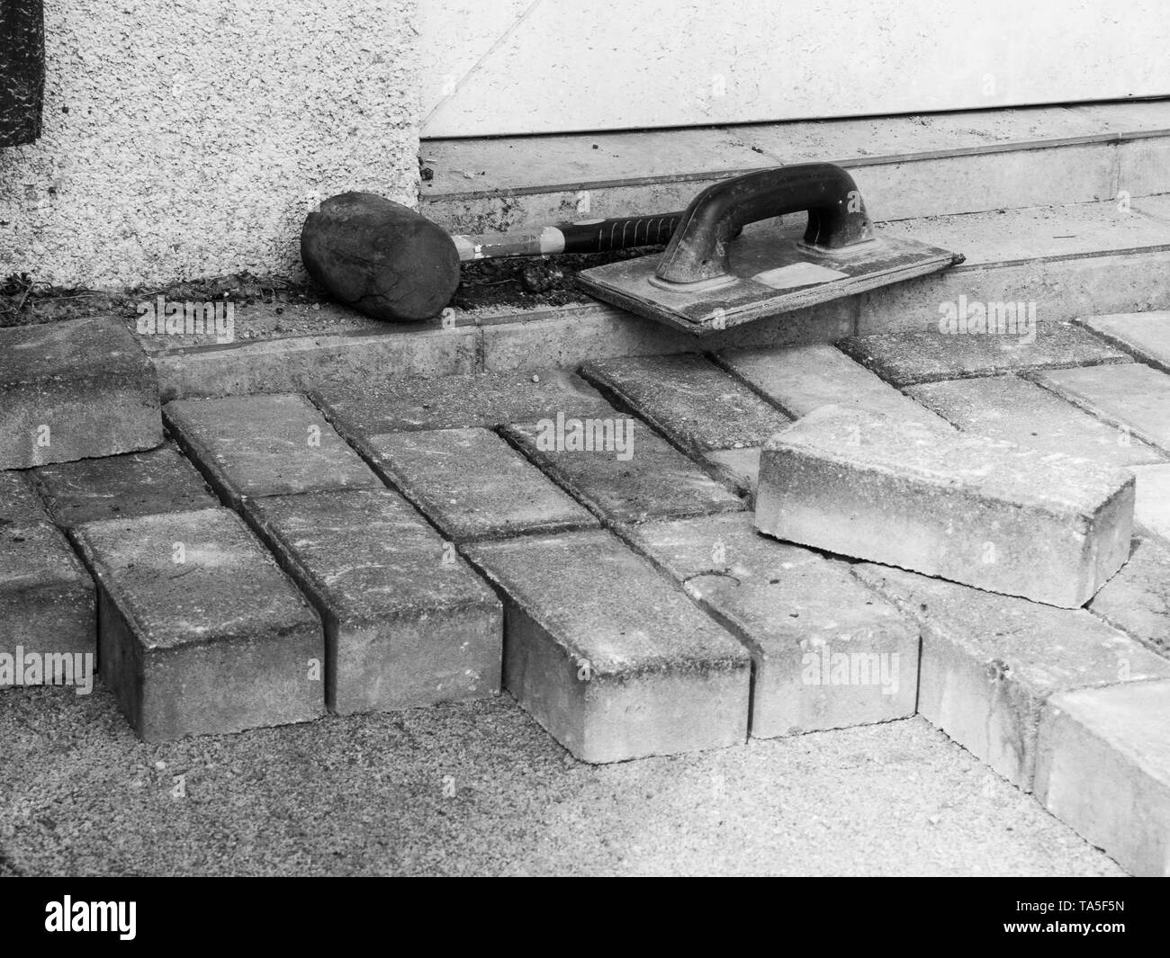 pavement materials, hammer, paddle patio outdoor Stock Photo