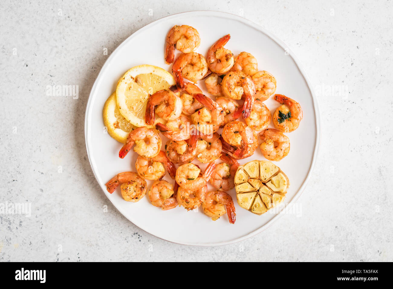 Roasted Shrimps With Lemon Garlic And Herbs Seafood Shelfish Shrimps Prawns Grilled With Spices Garlic And Lemon On White Stone Background Copy Stock Photo Alamy