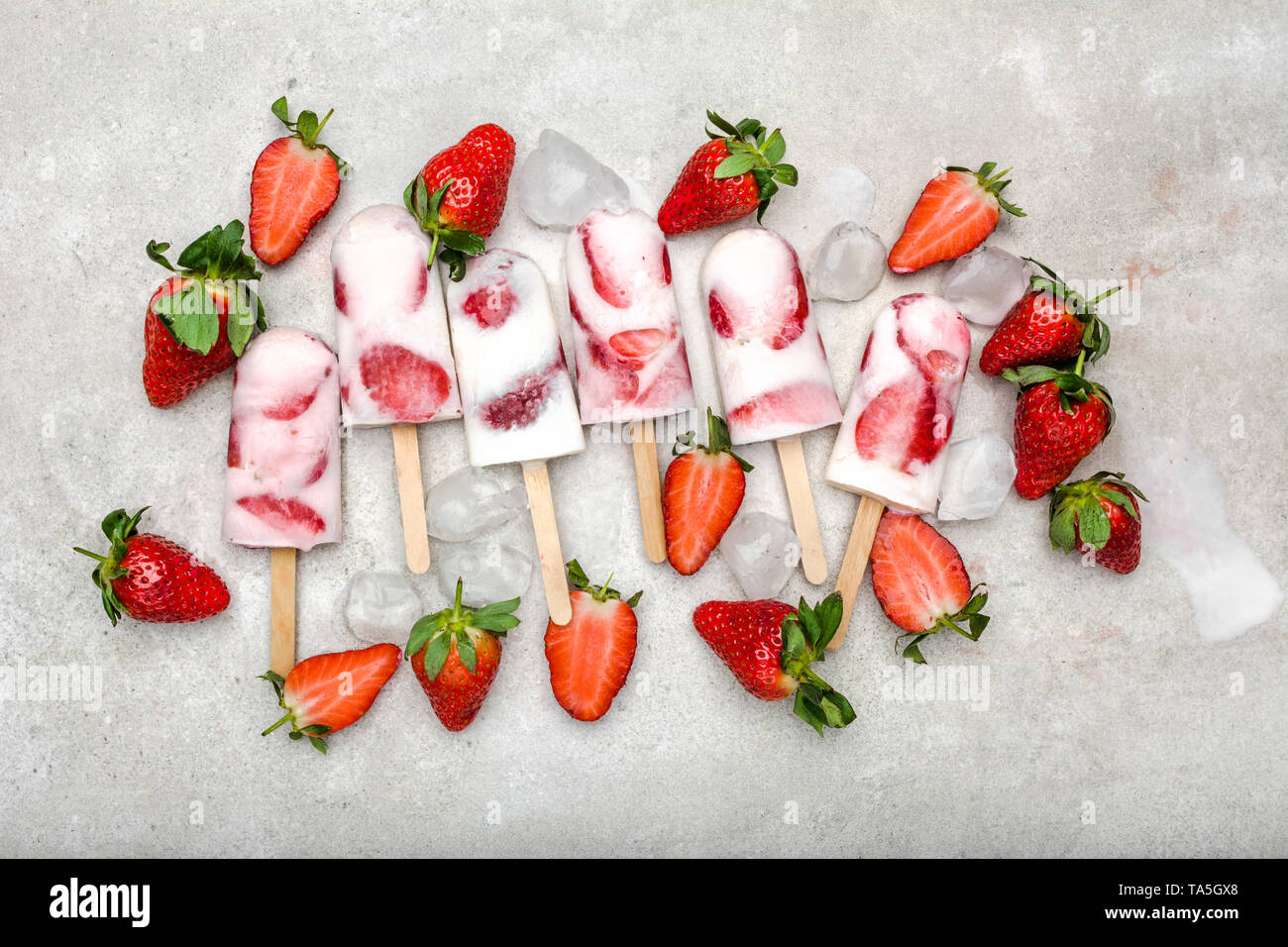 Fresh strawberry popsicle. Juicy fruit lollipops, fruity cold snack
