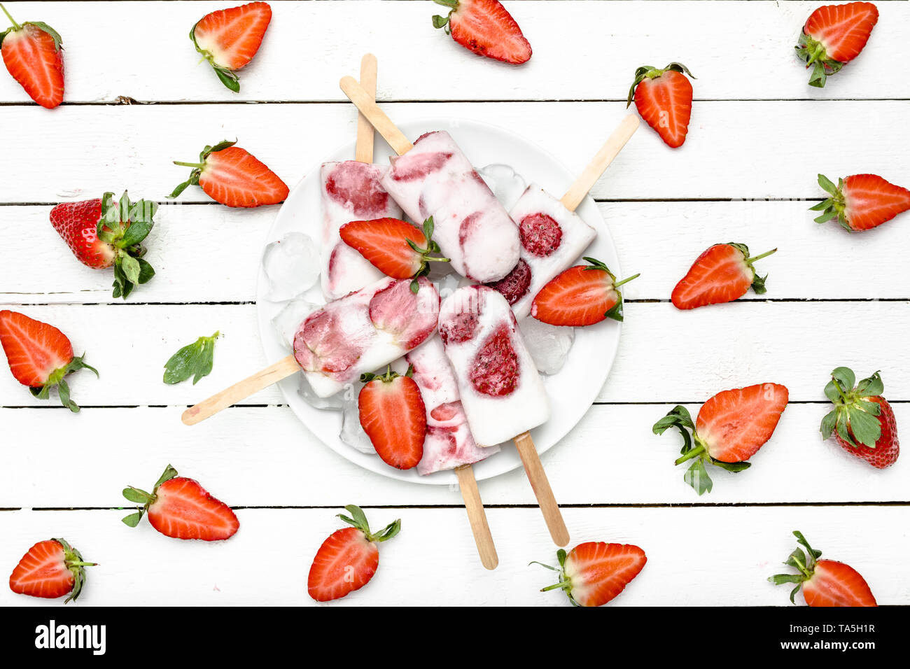 Fresh strawberry popsicle. Juicy fruit lollipops, fruity snack food for