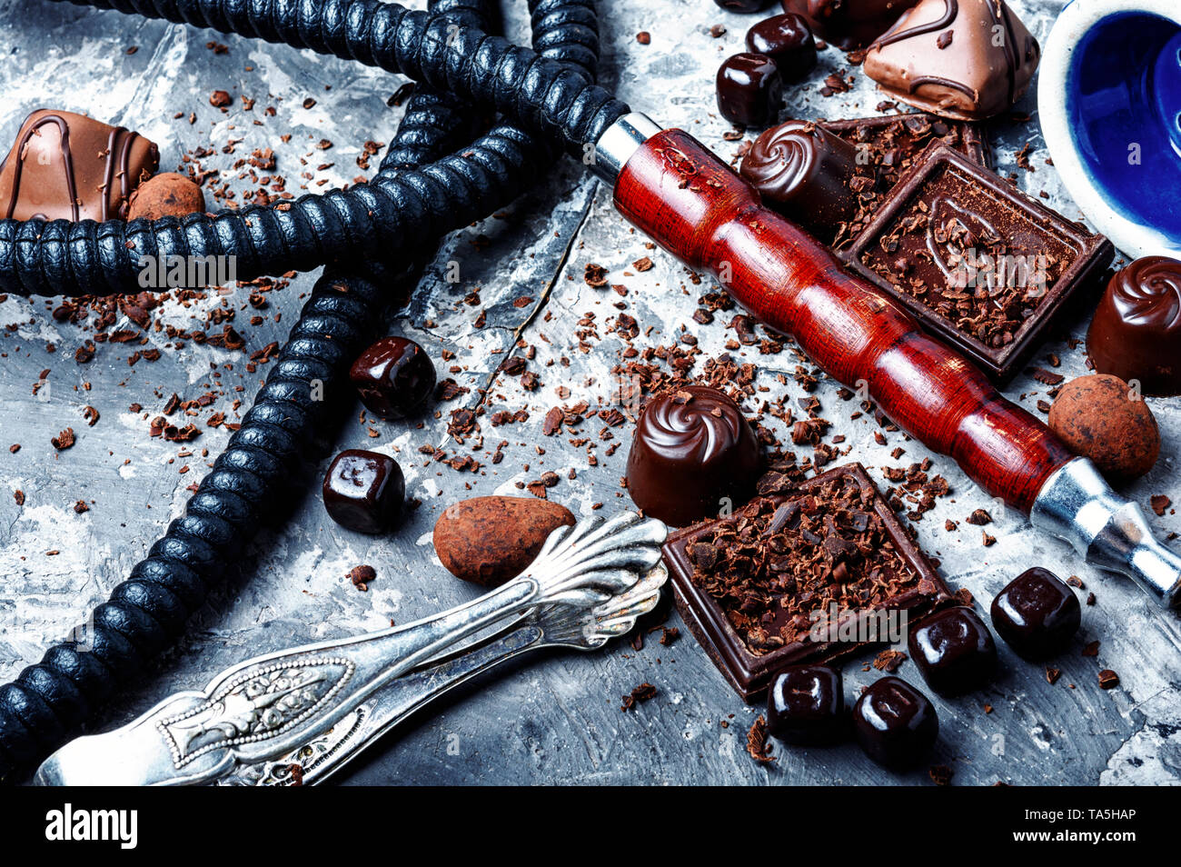 Oriental smoking hookah with a taste of chocolates. Chocolate tobacco flavor.Summer party, Stock Photo