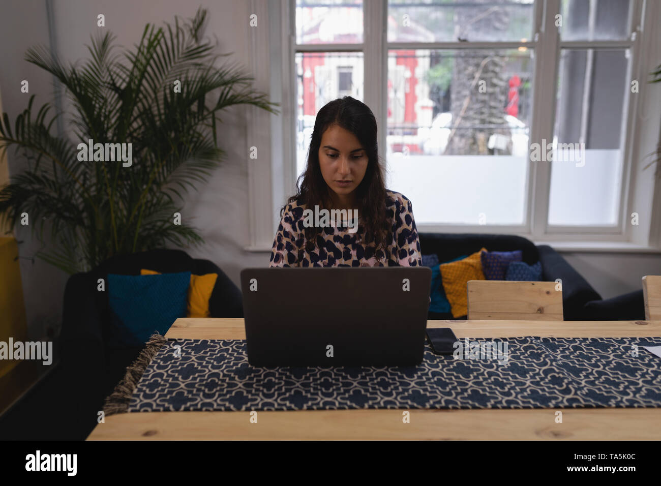 Female executive sitting at office desk hi-res stock photography and ...