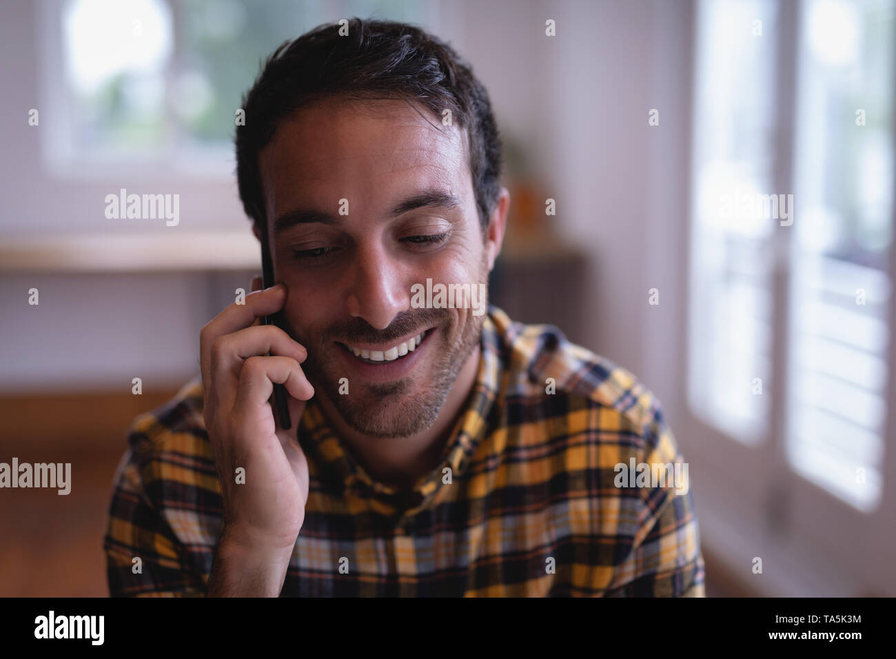Man executive talking on mobile phone in the office Stock Photo