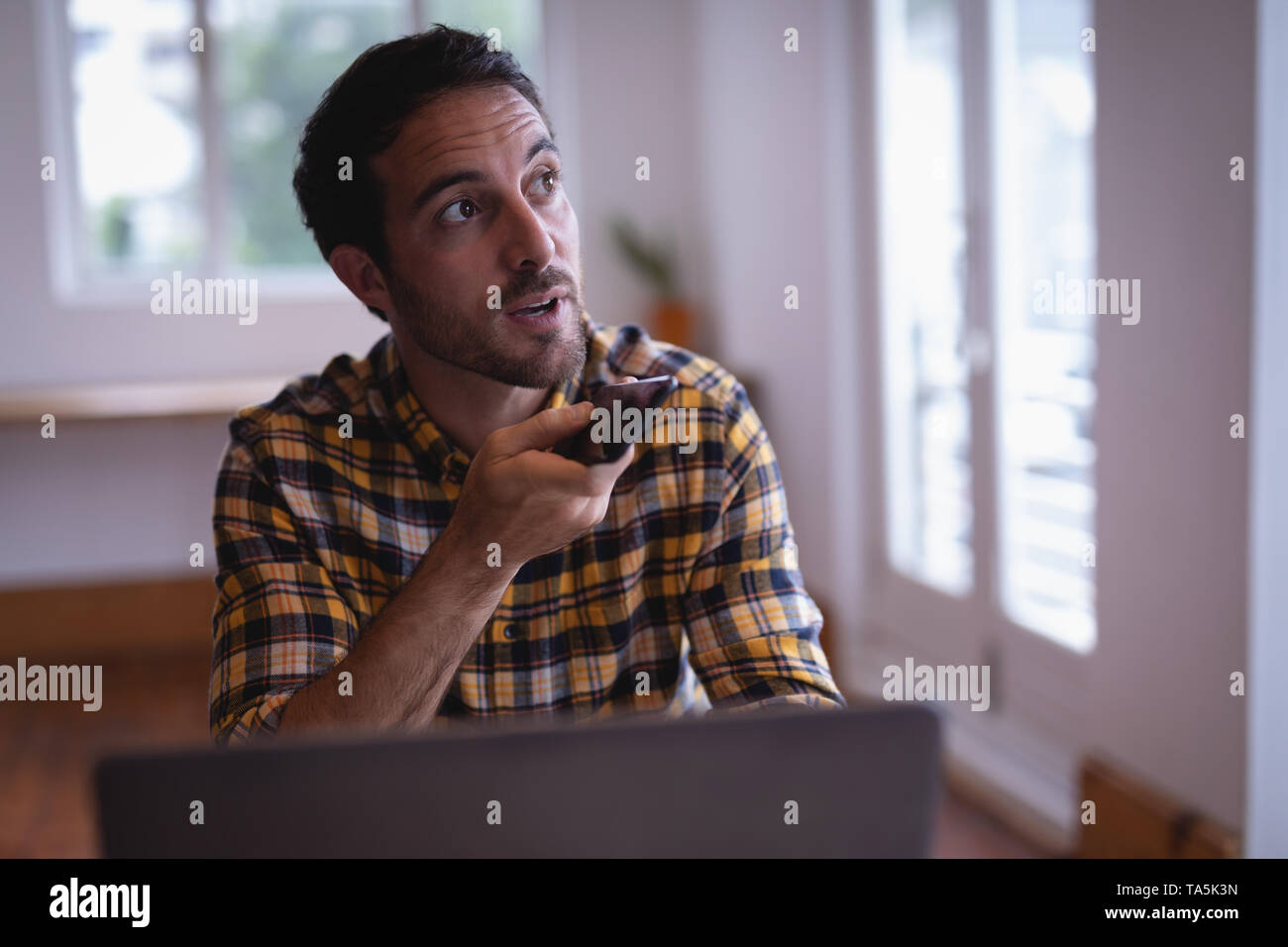 Man executive talking on mobile phone in the office Stock Photo