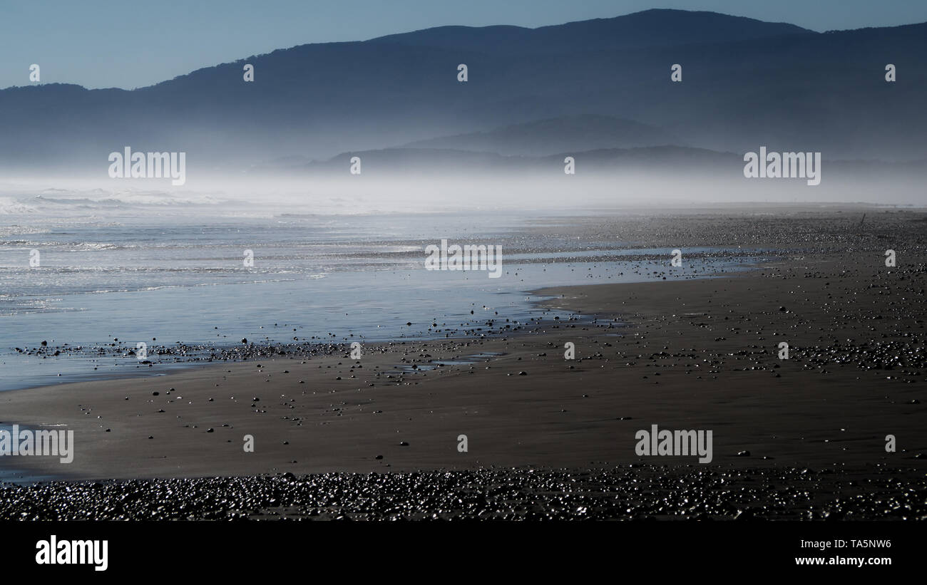 Marine fog on the beach of Cucao on the Island of Chiloe, southern Chile Stock Photo