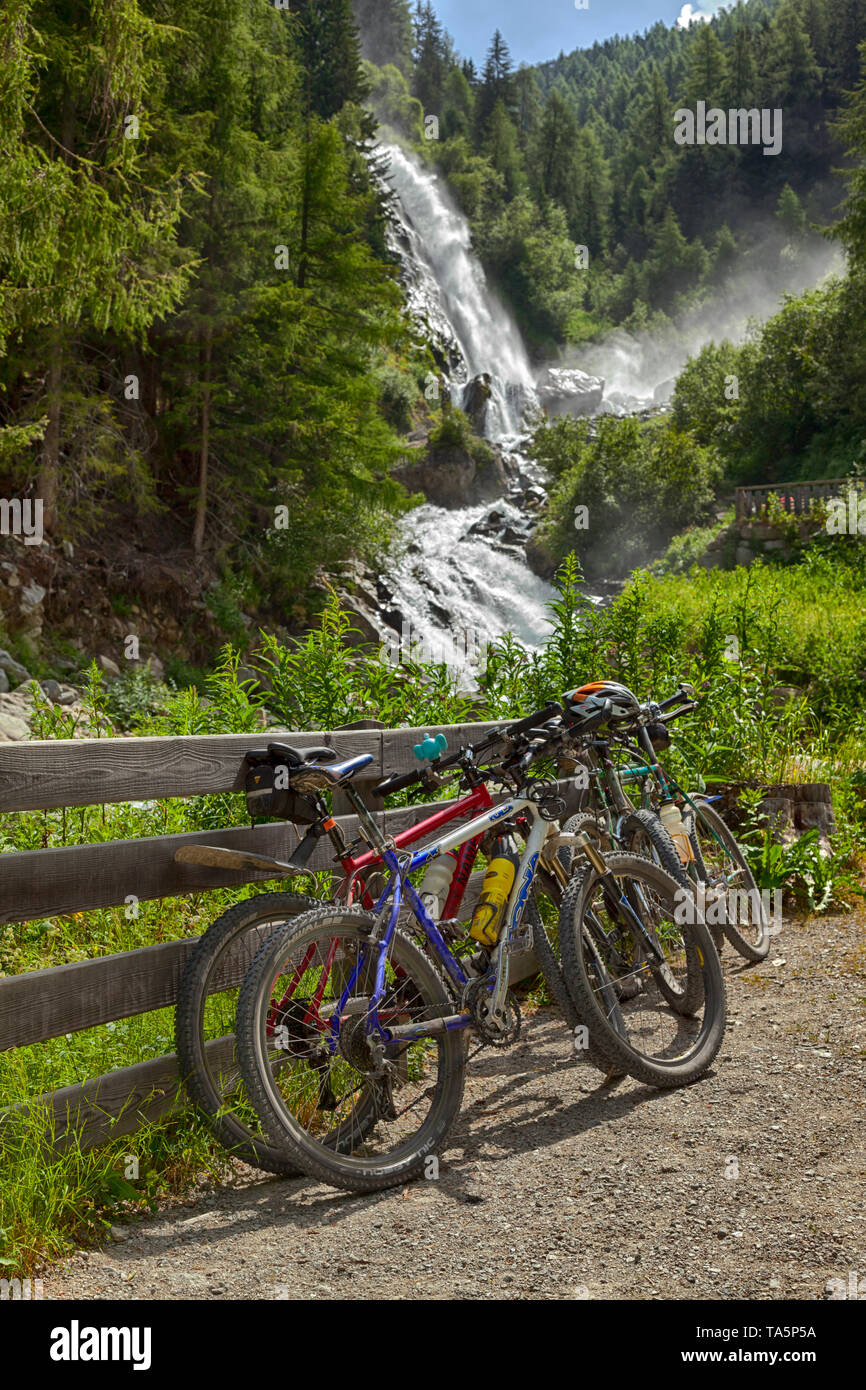 Mountain bikes parked at trekking and biking trail, Stuibenfall waterfall, Umhausen, Ötztal Valley, Austria. Oytal, Allgäu, near Oberstdorf. Nature. Stock Photo