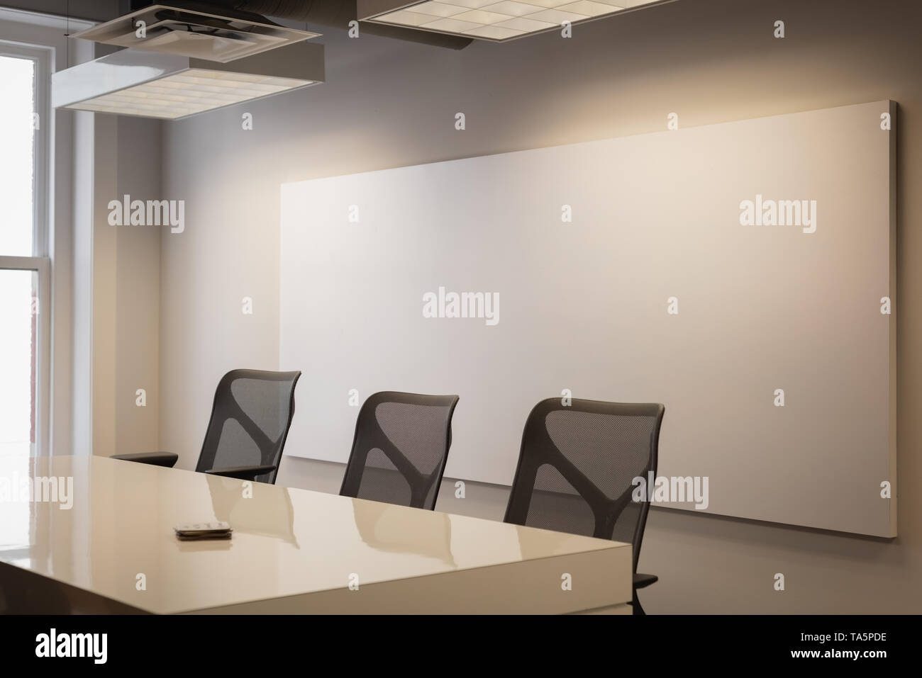 Empty chairs and table at conference room Stock Photo