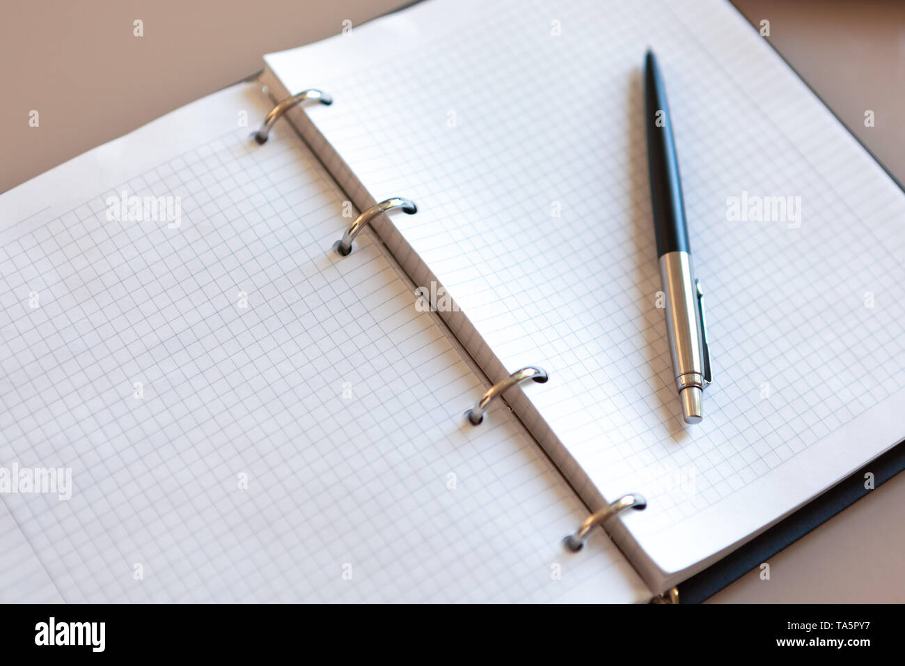 Pen lying on open book hi-res stock photography and images - Alamy