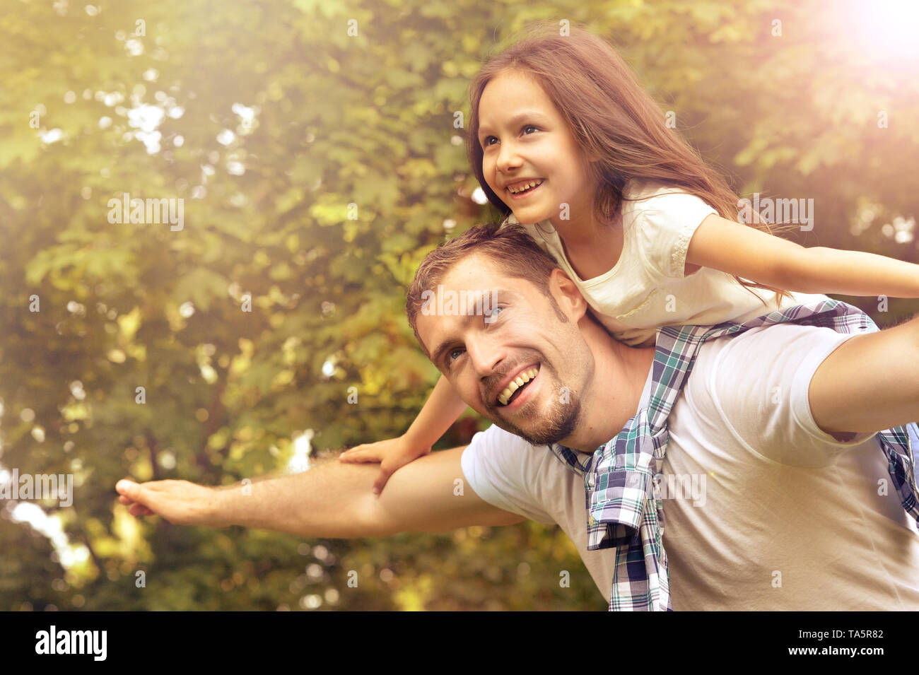 Portrait of father with daughter in summer park Stock Photo