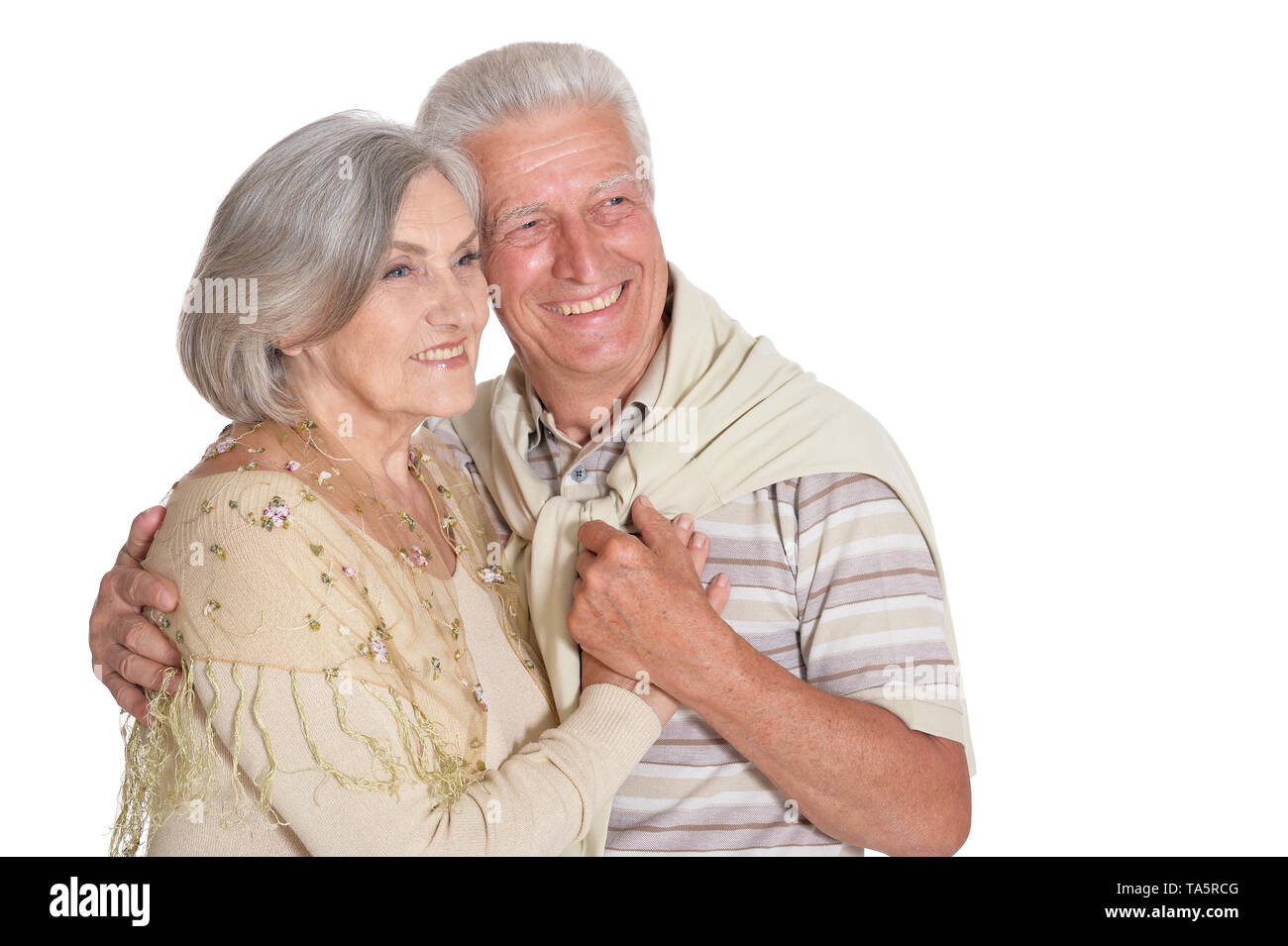 Portrait of happy senior couple holding hands isolated Stock Photo