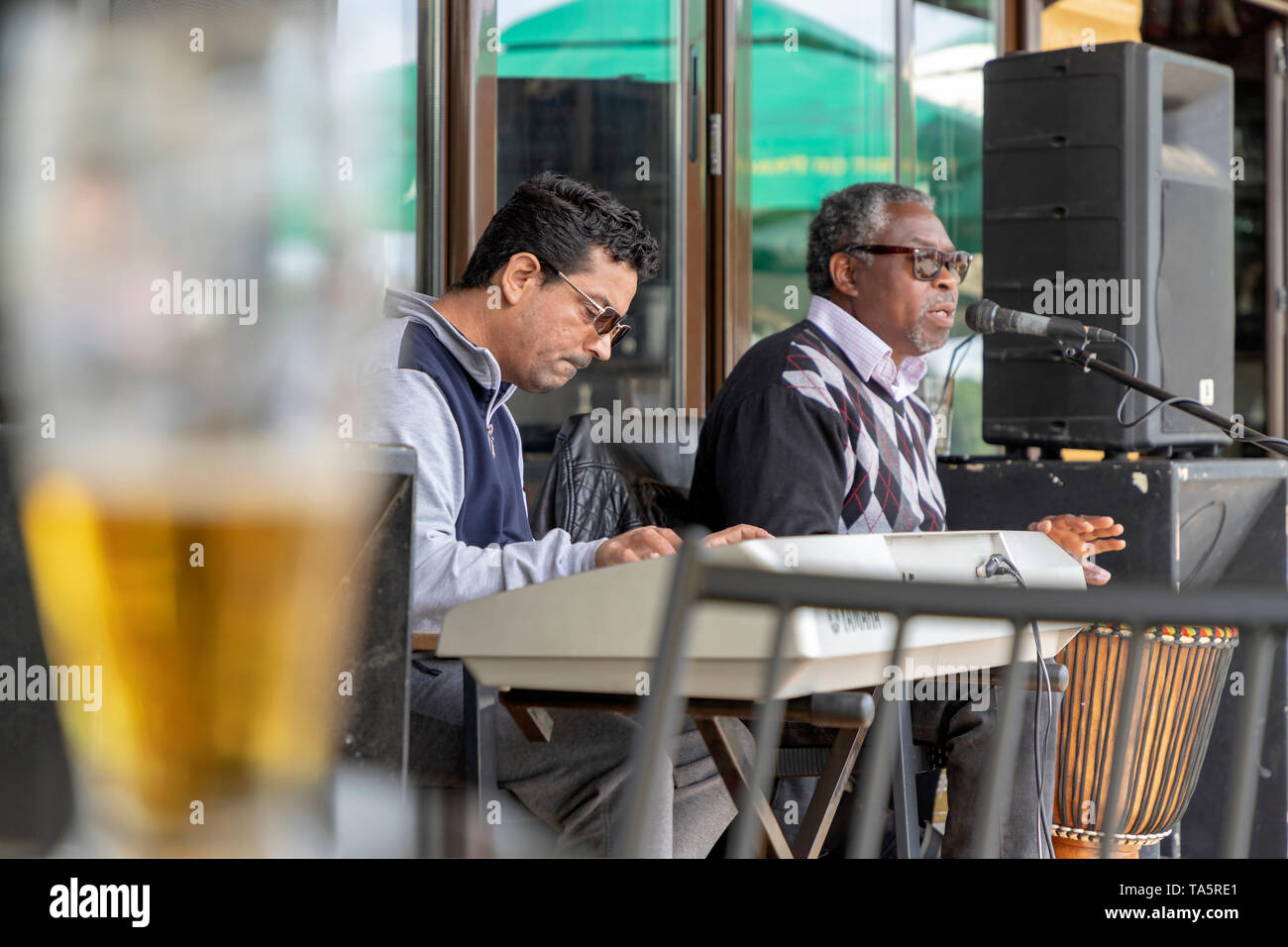 Belgrade, Serbia, May 12th 2019: Two musicians performing at the terrace of Ada Ciganlija lakefront cafe Stock Photo