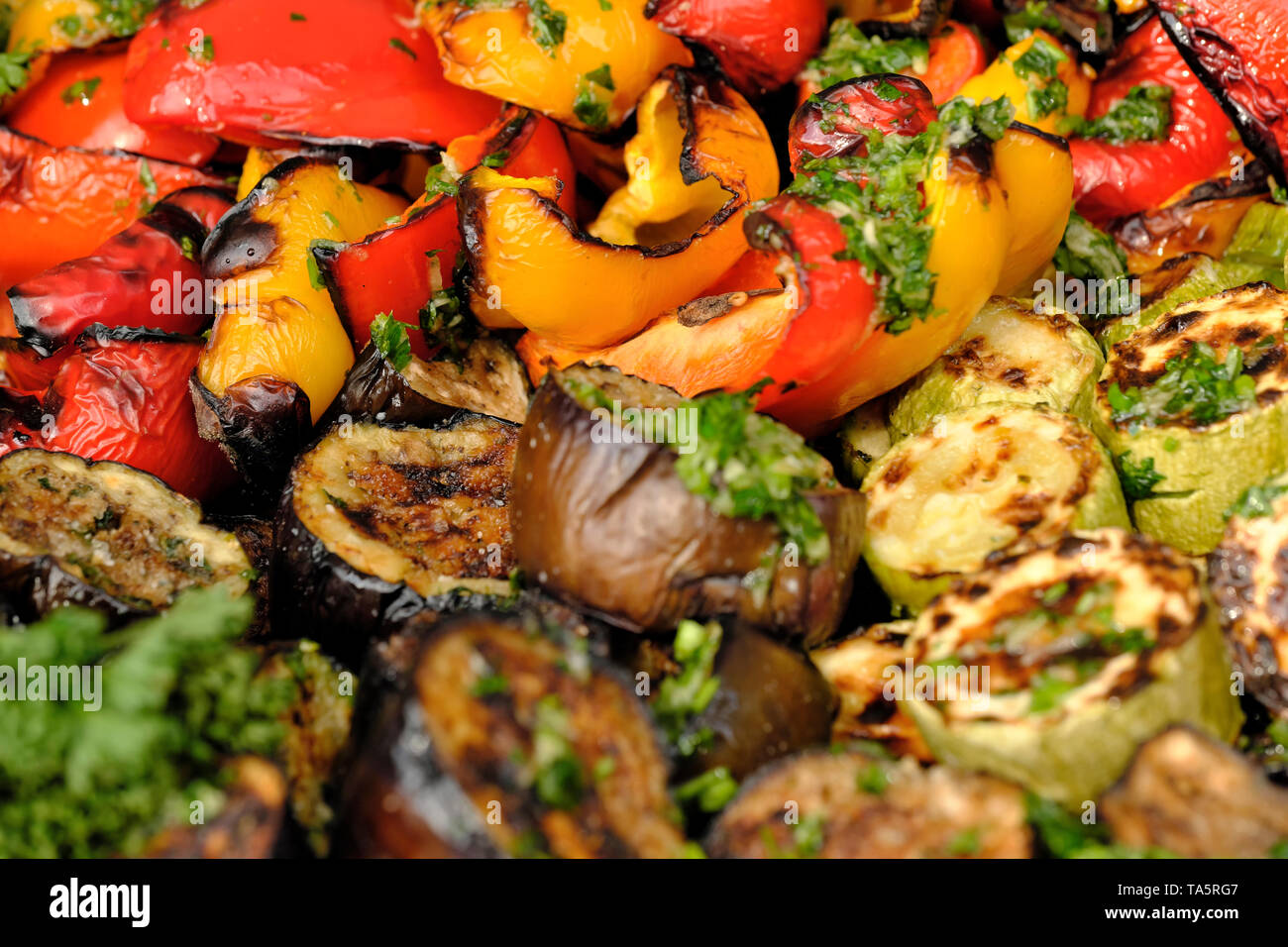 Grilled vegetables cooked outdoors on a bright sunny spring day Stock Photo