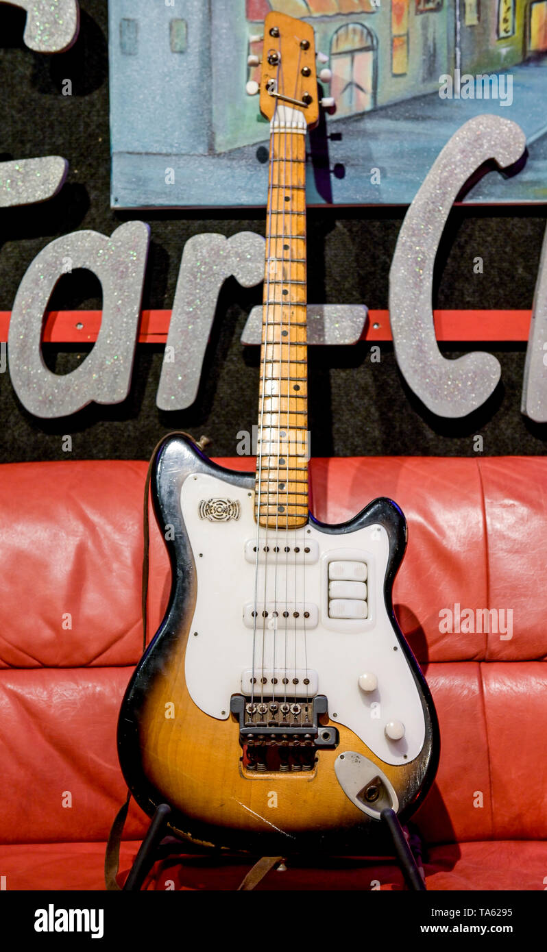 Hamburg, Germany. 22nd May, 2019. George Harrison's "Futurama" guitar is on  display on a couch in Hamburg's "No.1 Guitar Center" before its auction in  London. The Beatles member played this guitar during