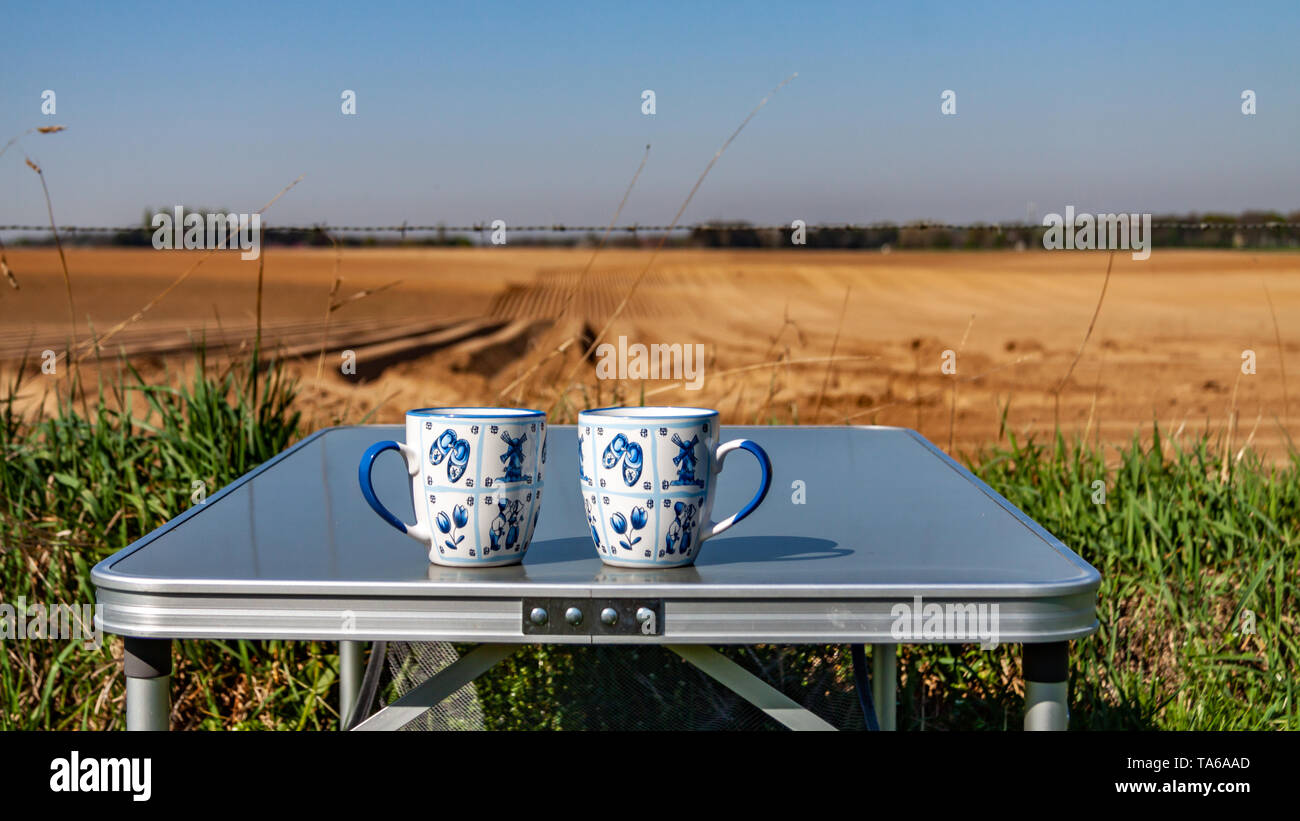 Two Ceramic Mugs With Dutch Decoration In Blue And White On A