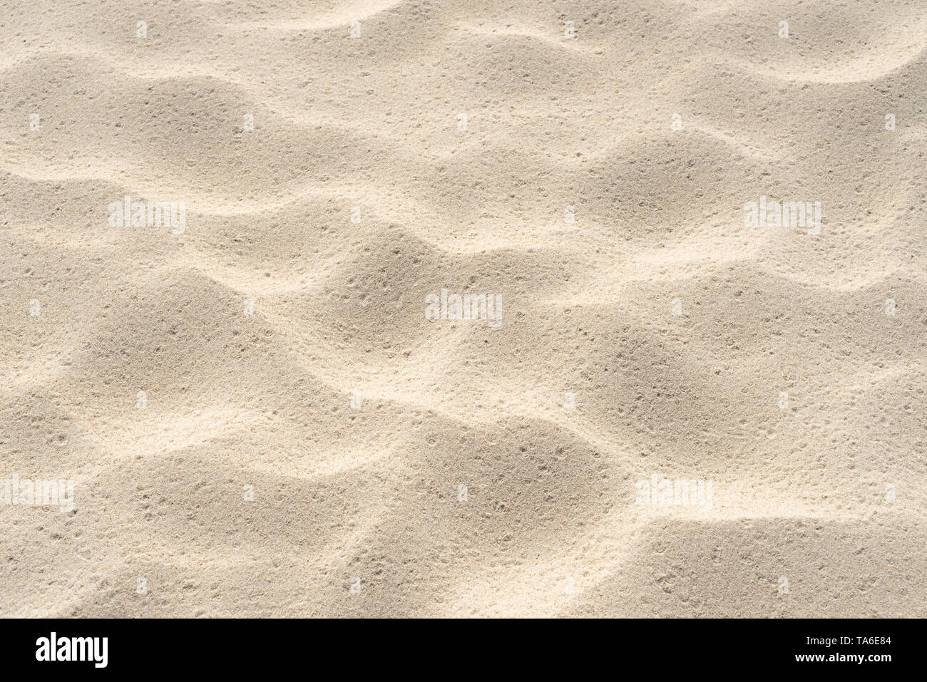 Abstract sand pattern. Summer background with sand texture on the beach by the sea Stock Photo
