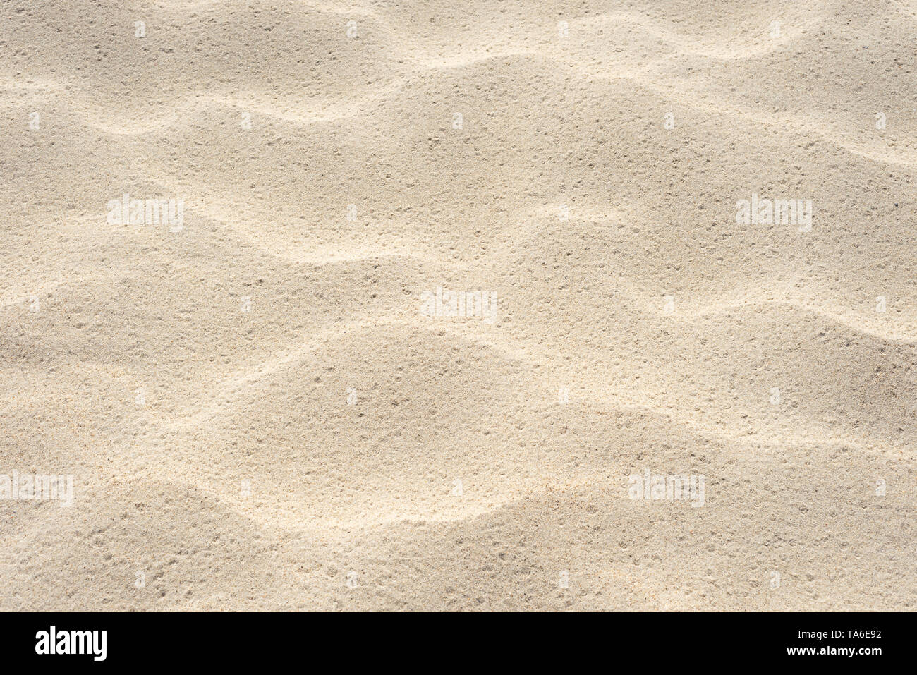 Beach sand texture. Summer background with a fragment of the seaside resort beach. Abstraction in nature Stock Photo
