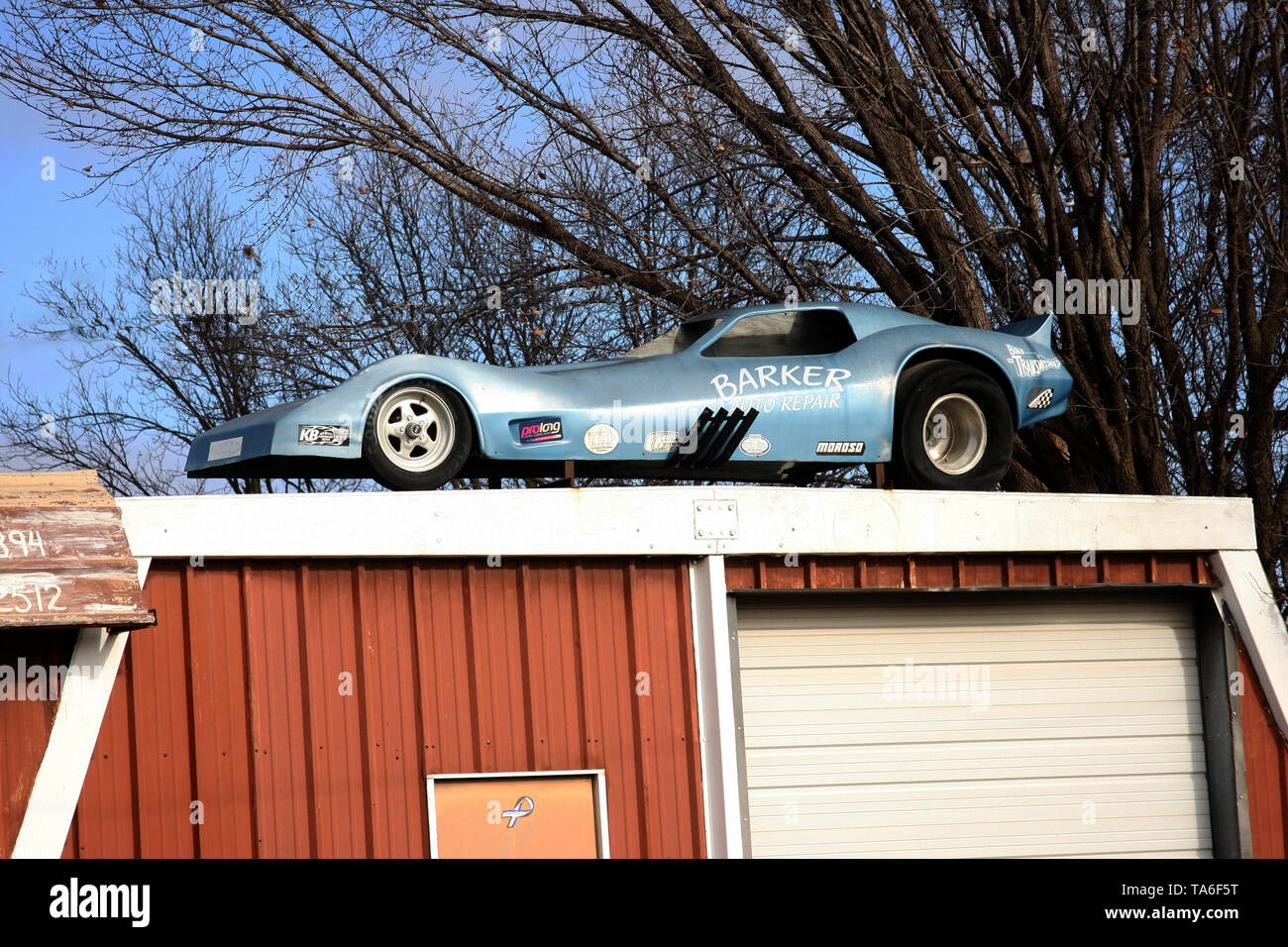 Sports car on top of a garage roof Stock Photo Alamy