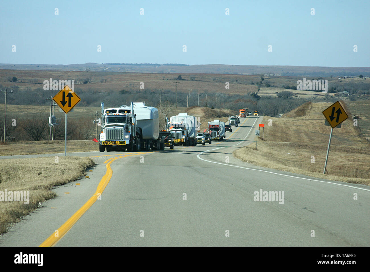 Oversize load convoy on highway in Oklahoma, USA Stock Photo