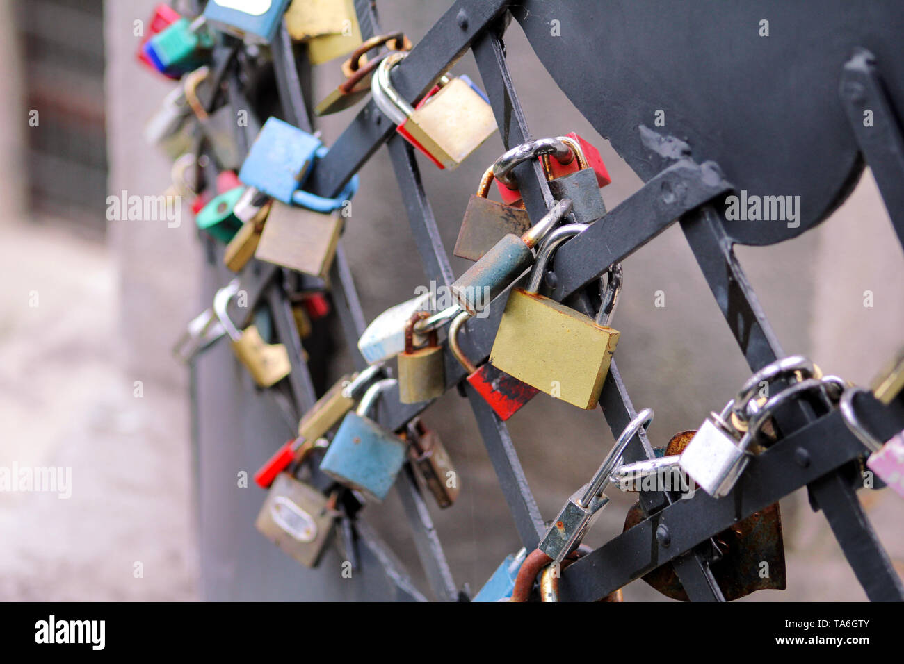Love locks hang from bridge in Prague representing secure friendship