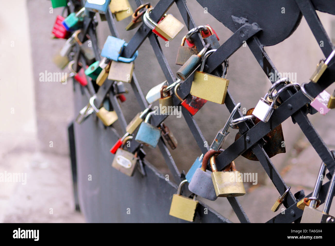 Love locks hang from bridge in Prague representing secure friendship